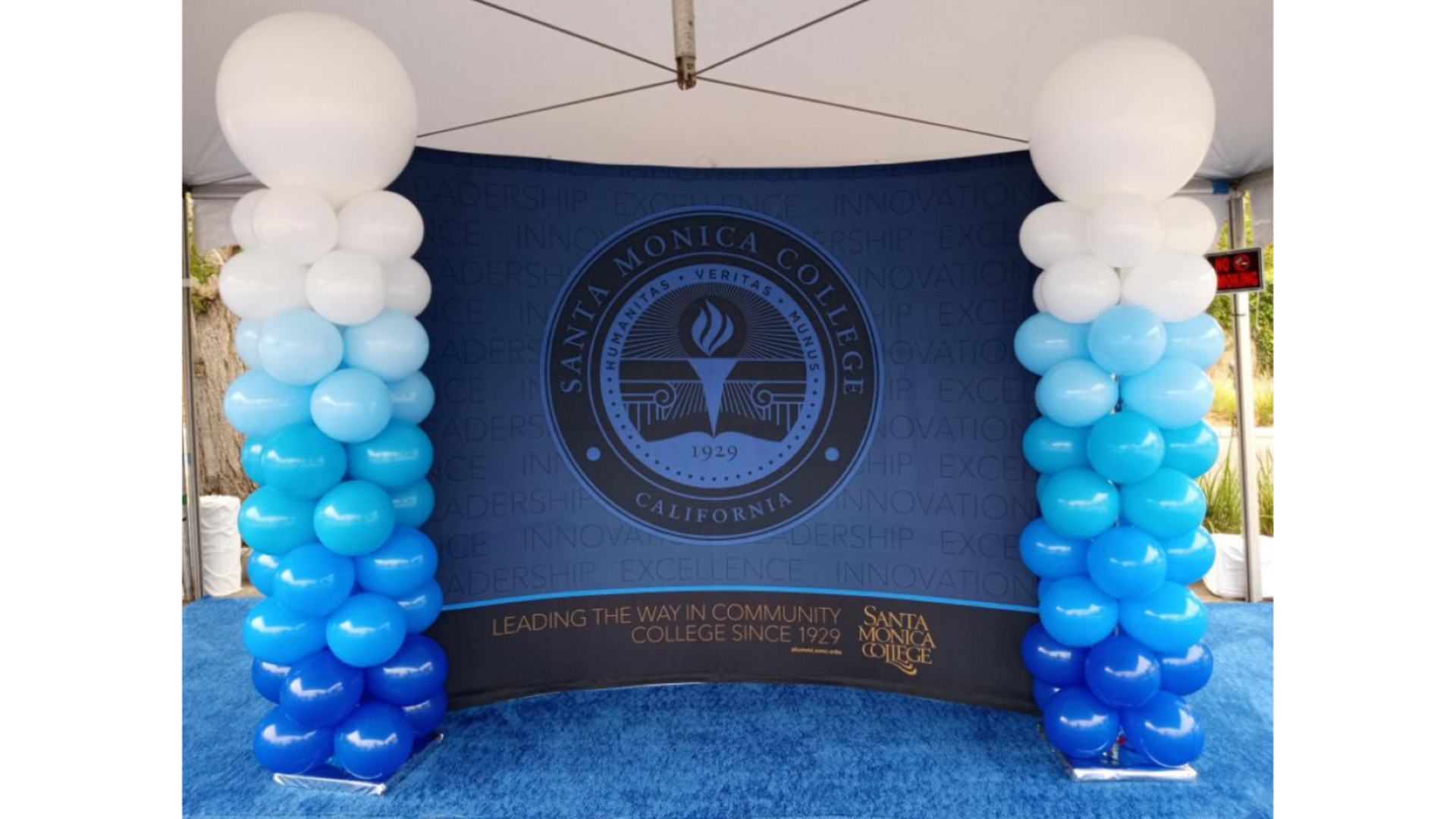 Santa Monica College emblem with blue balloons