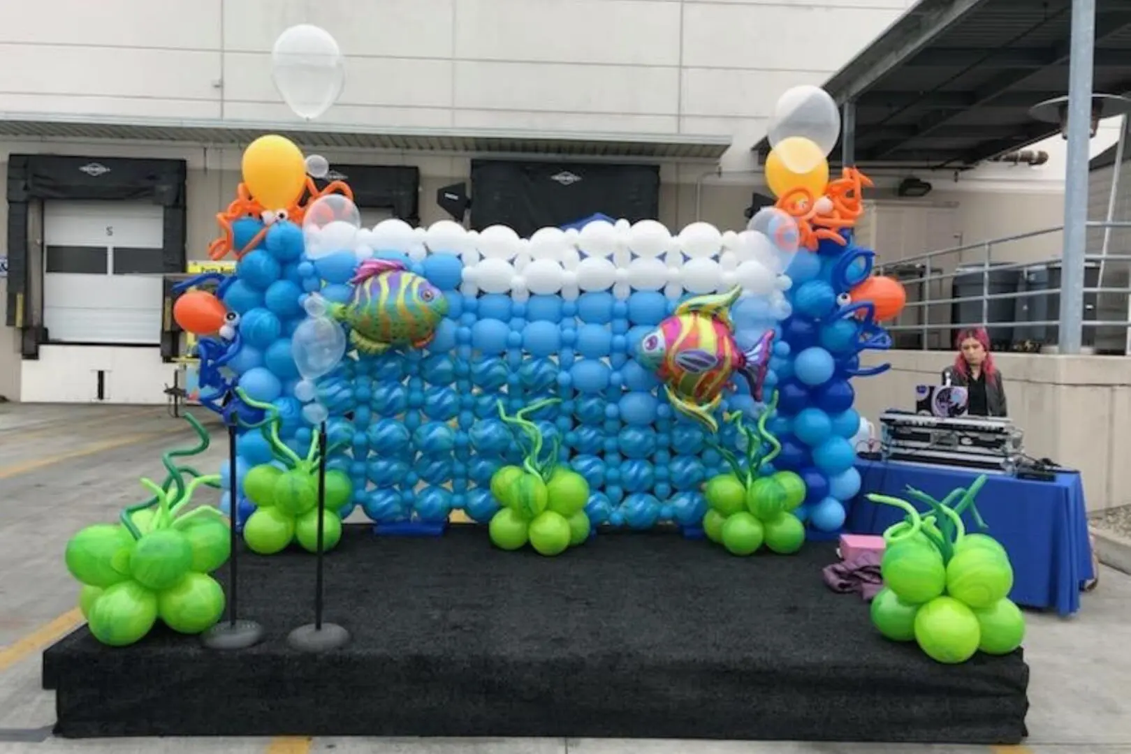Underwater-themed balloon decoration with DJ