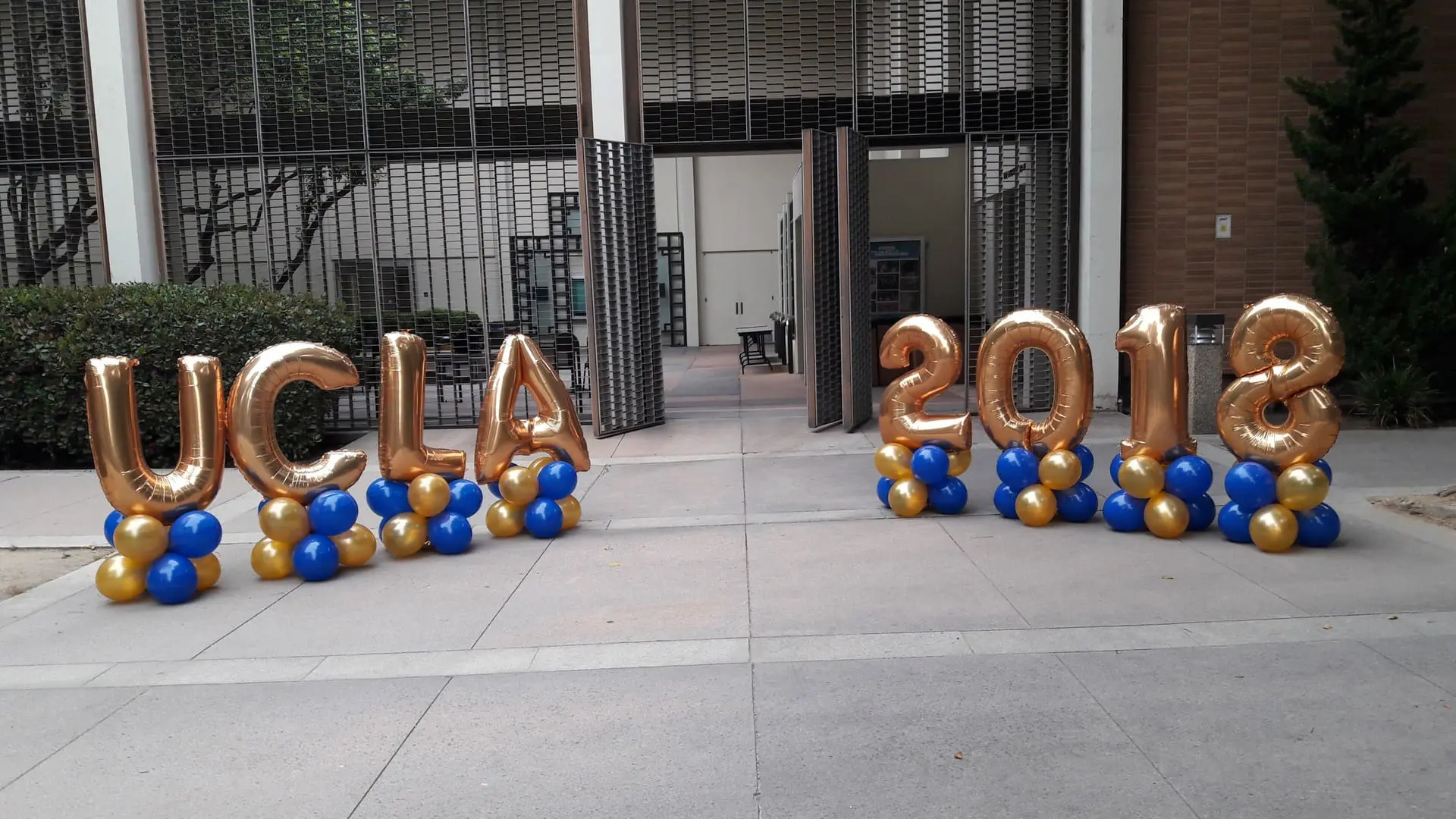 UCLA 2018 gold and blue balloon display