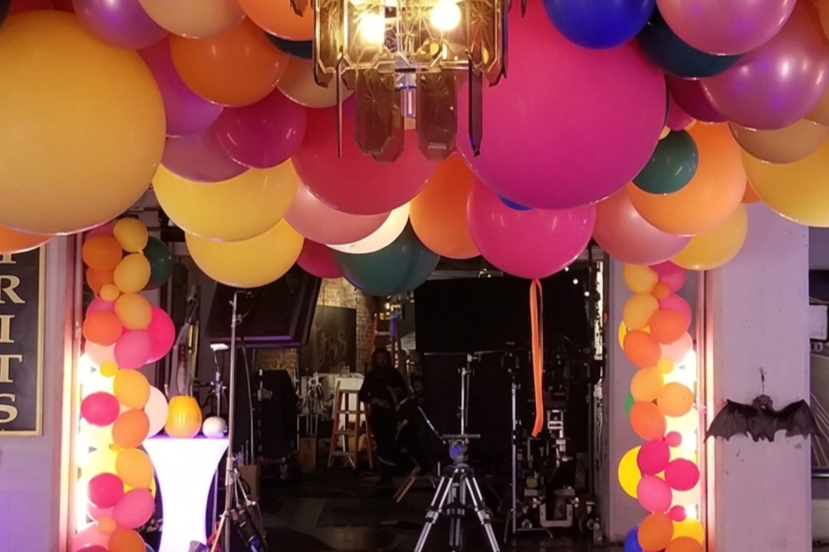 Colorful balloon arch and ceiling decorations