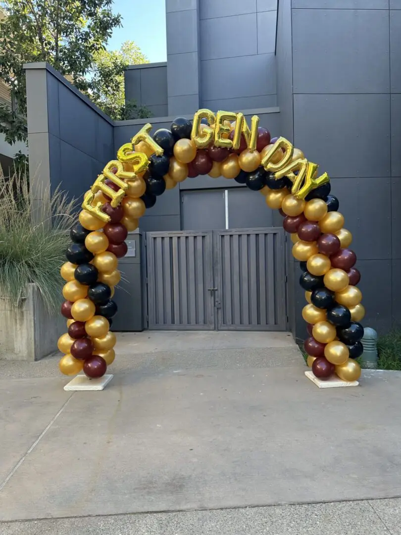 Black maroon gold balloon arch First Gen Day