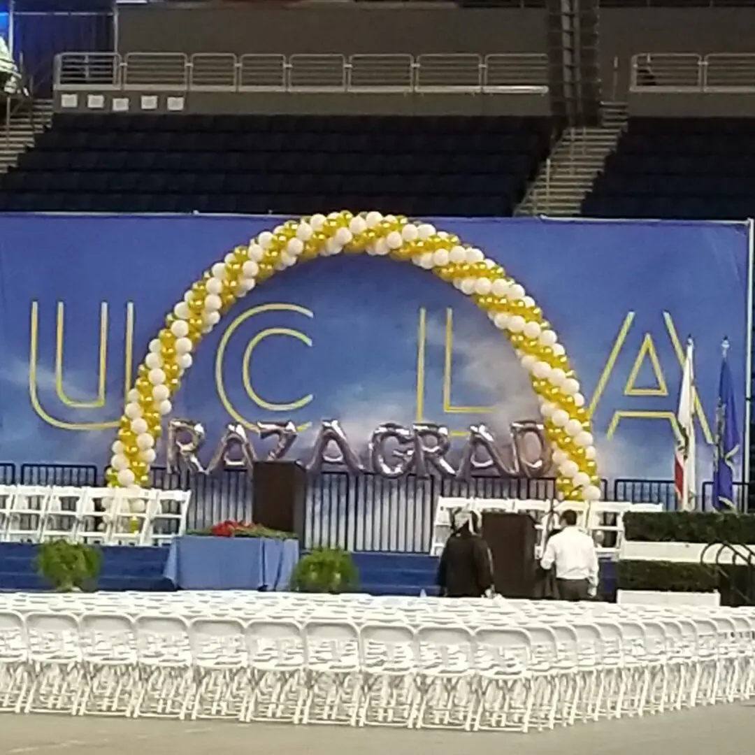 UCLA graduation stage with balloon arch