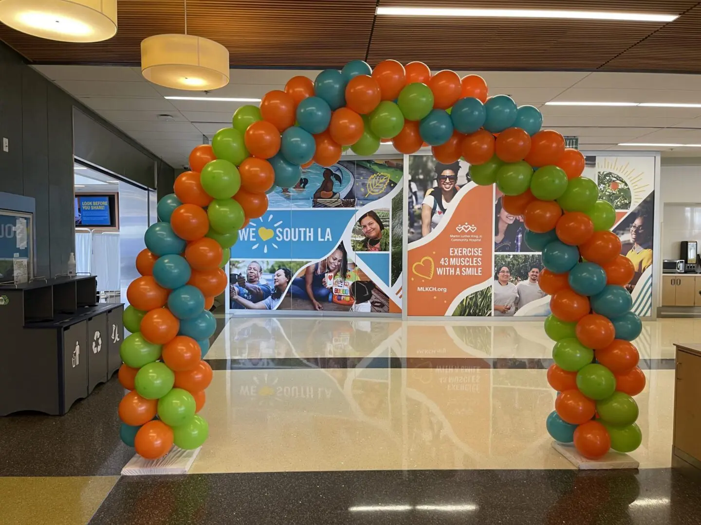 Colorful balloon arch in community center lobby