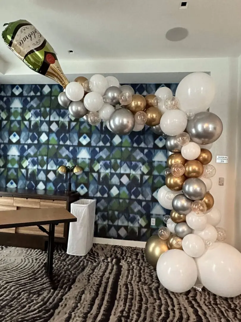 Gold, silver and white champagne balloon arch