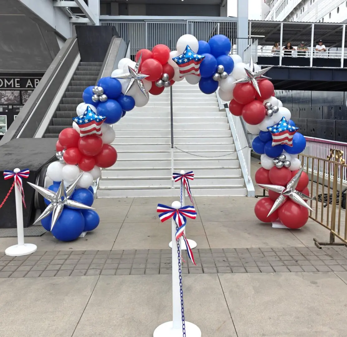 Red white blue balloon arch with silver stars