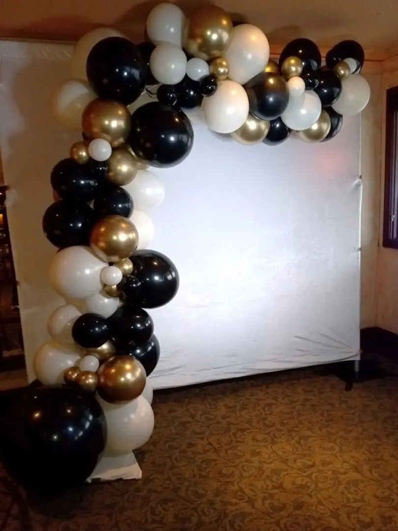 Black, white and gold balloon arch