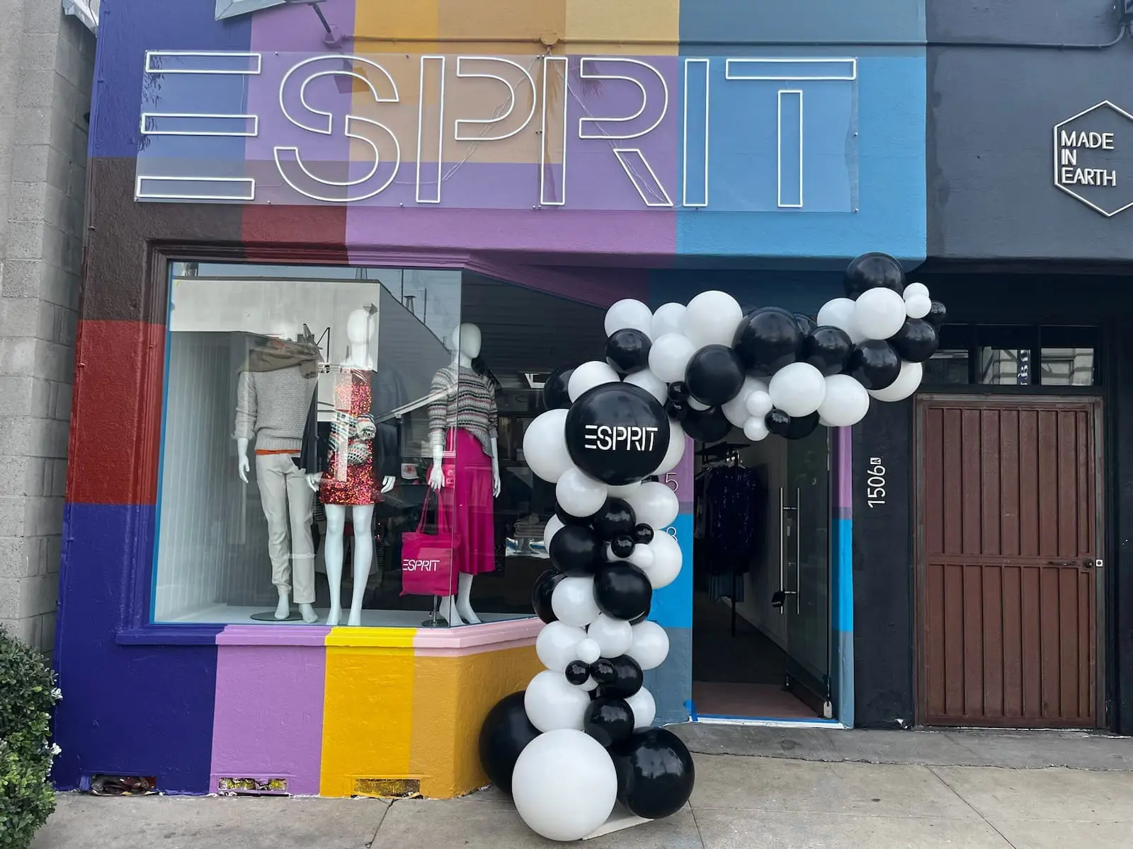 Colorful Esprit storefront with mannequins and balloons