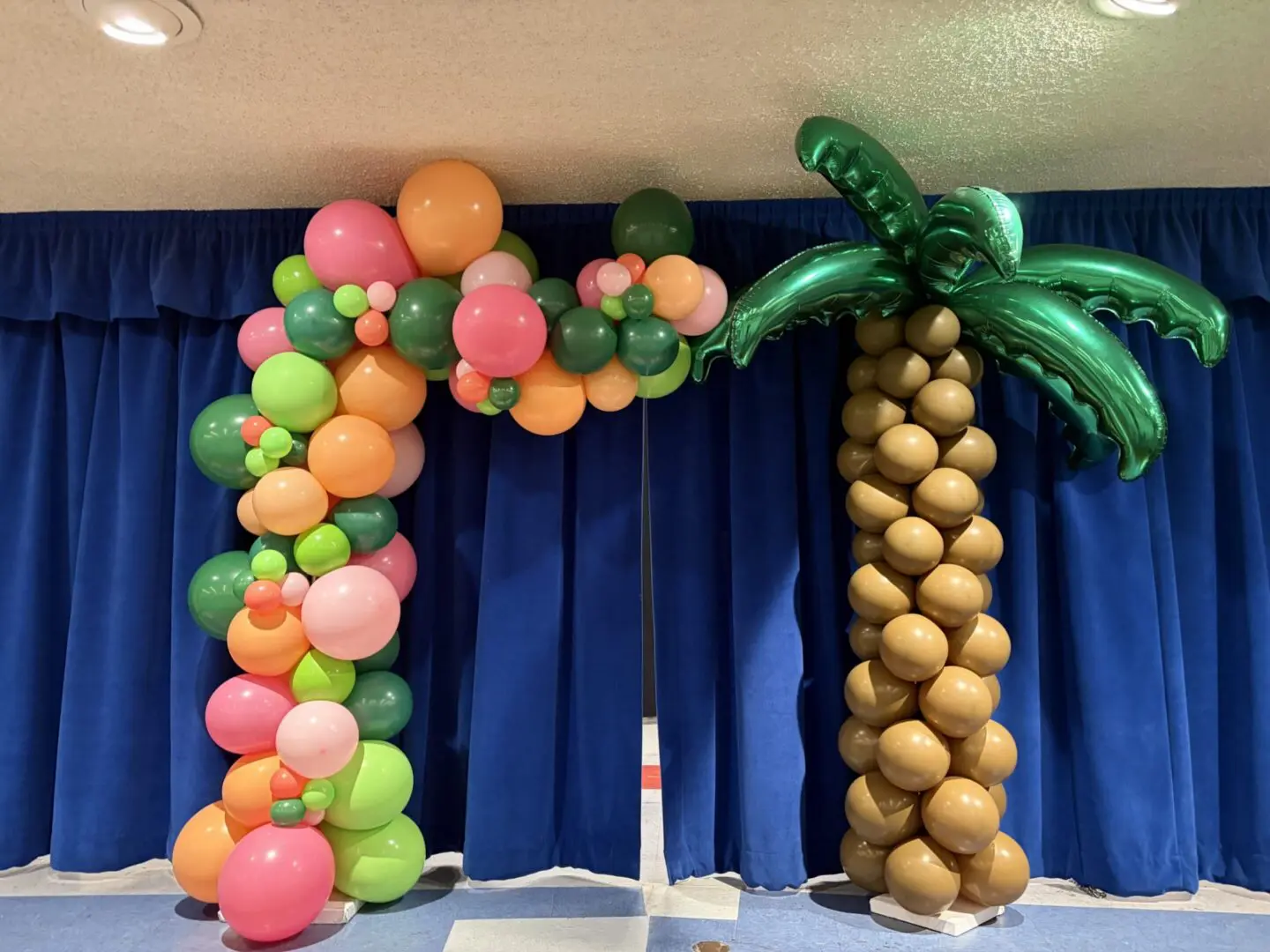 Colorful balloon arch and balloon palm tree