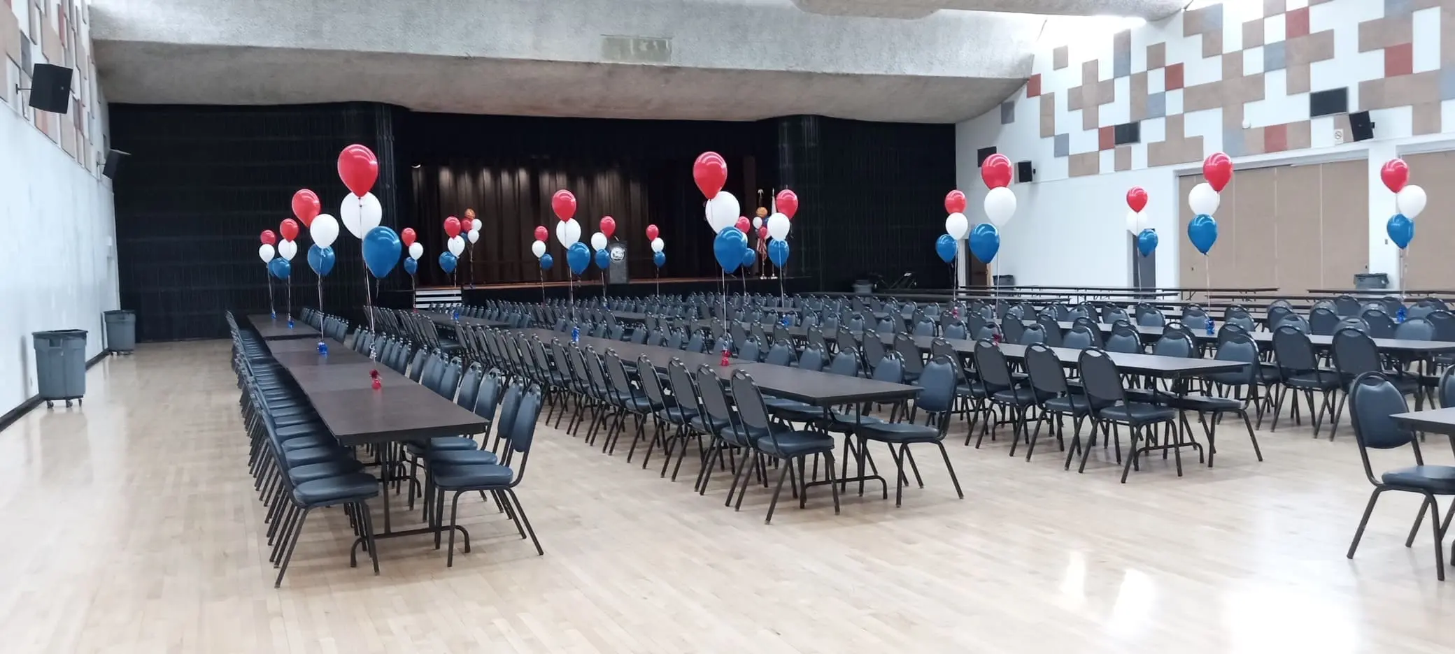 banquet hall with red, white, blue balloons