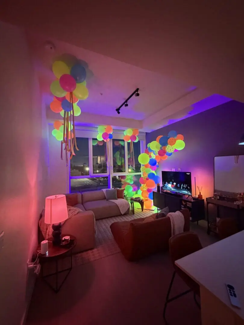 Cozy living room with glowing neon balloons