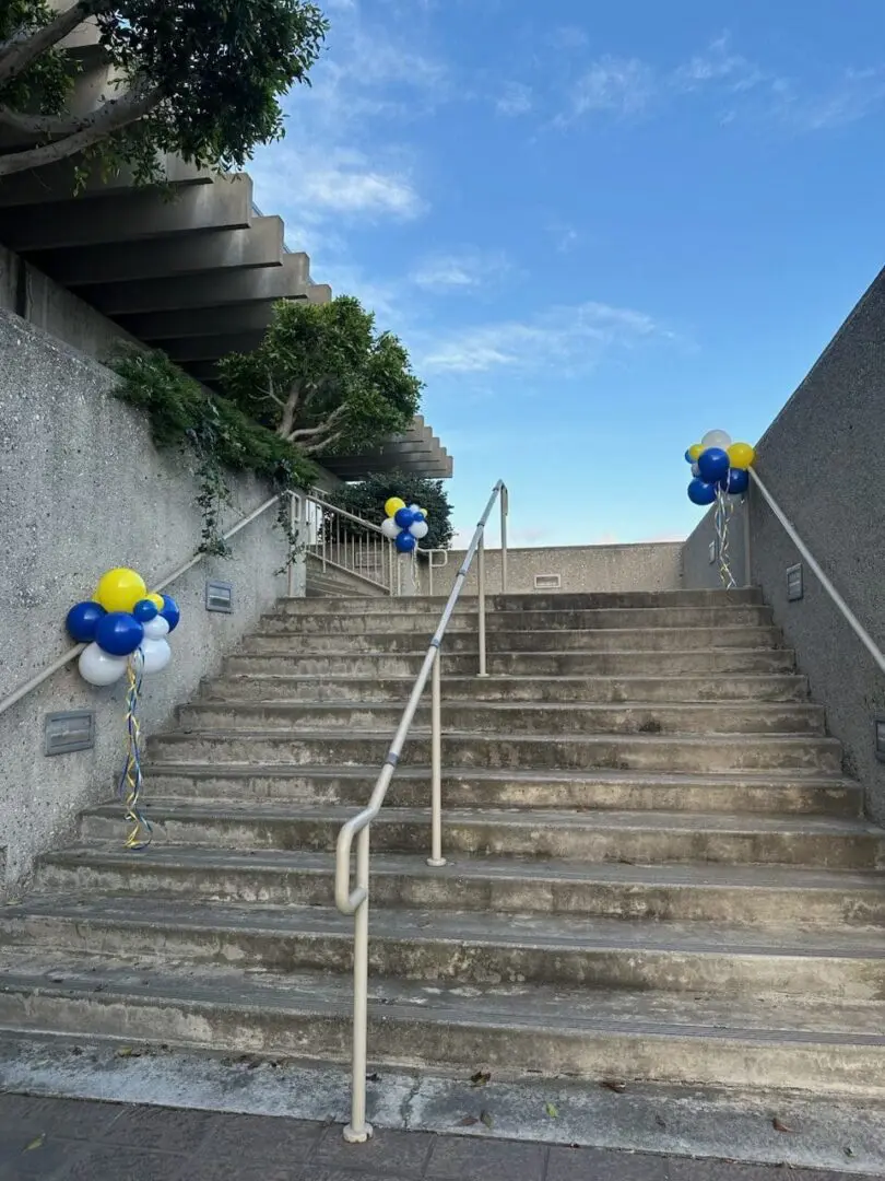Outdoor concrete stairs decorated with balloons
