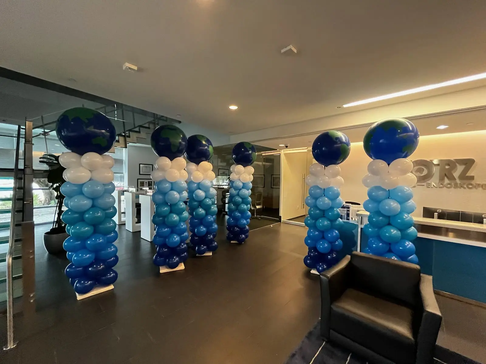 Office lobby with globe-topped balloon columns
