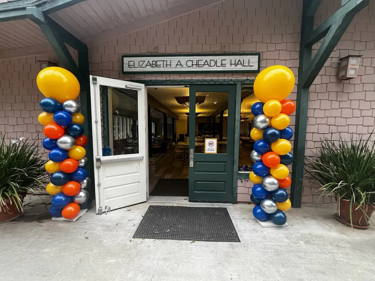 Balloon columns flanking Elizabeth A. Cheadle Hall entrance