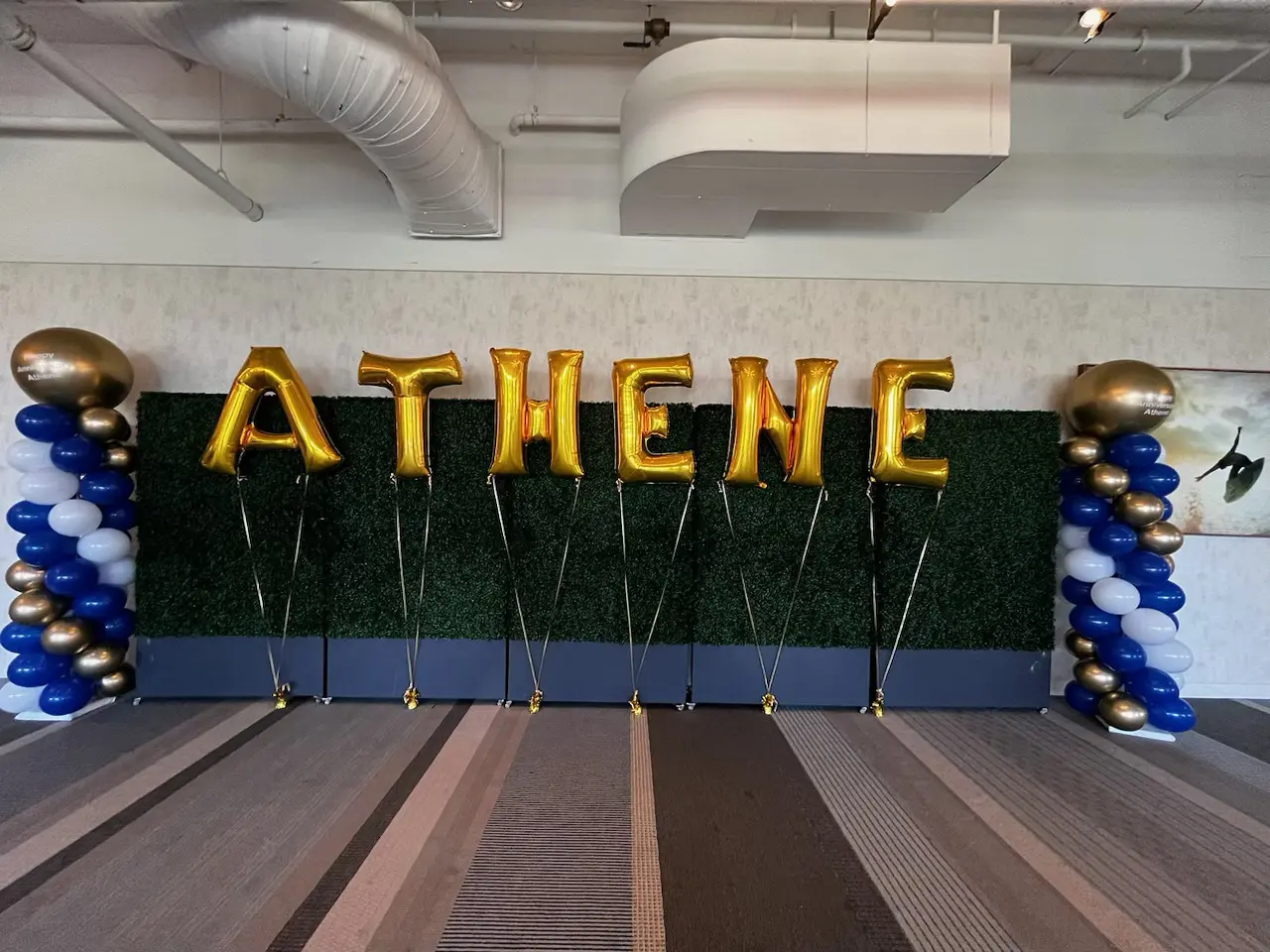 Gold ATHENE balloon letters event backdrop