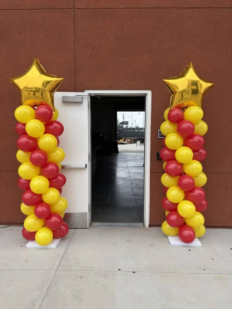 Entrance with red and yellow balloon columns