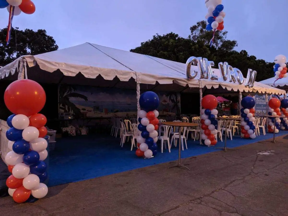 Outdoor tent with red white blue balloons