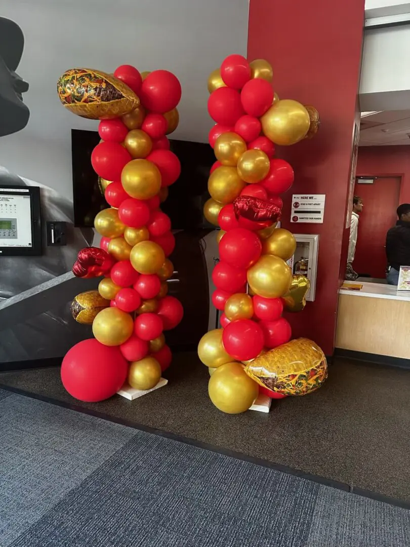 Red and gold decorative balloon columns
