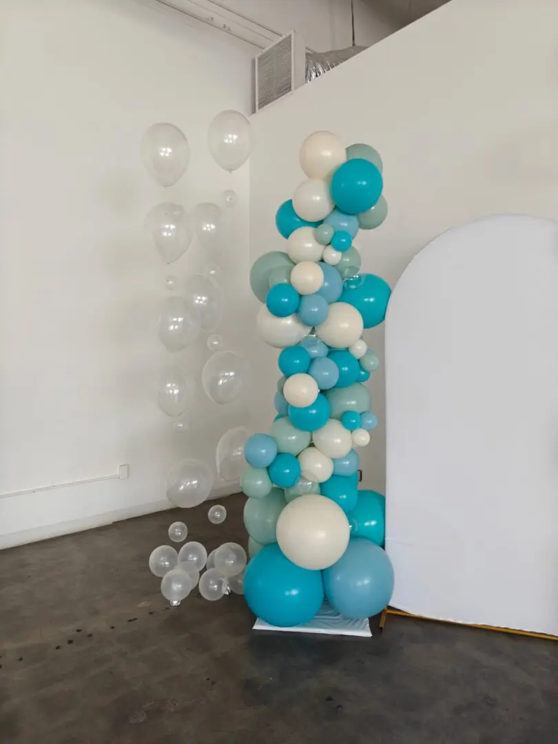 Teal and white balloon column