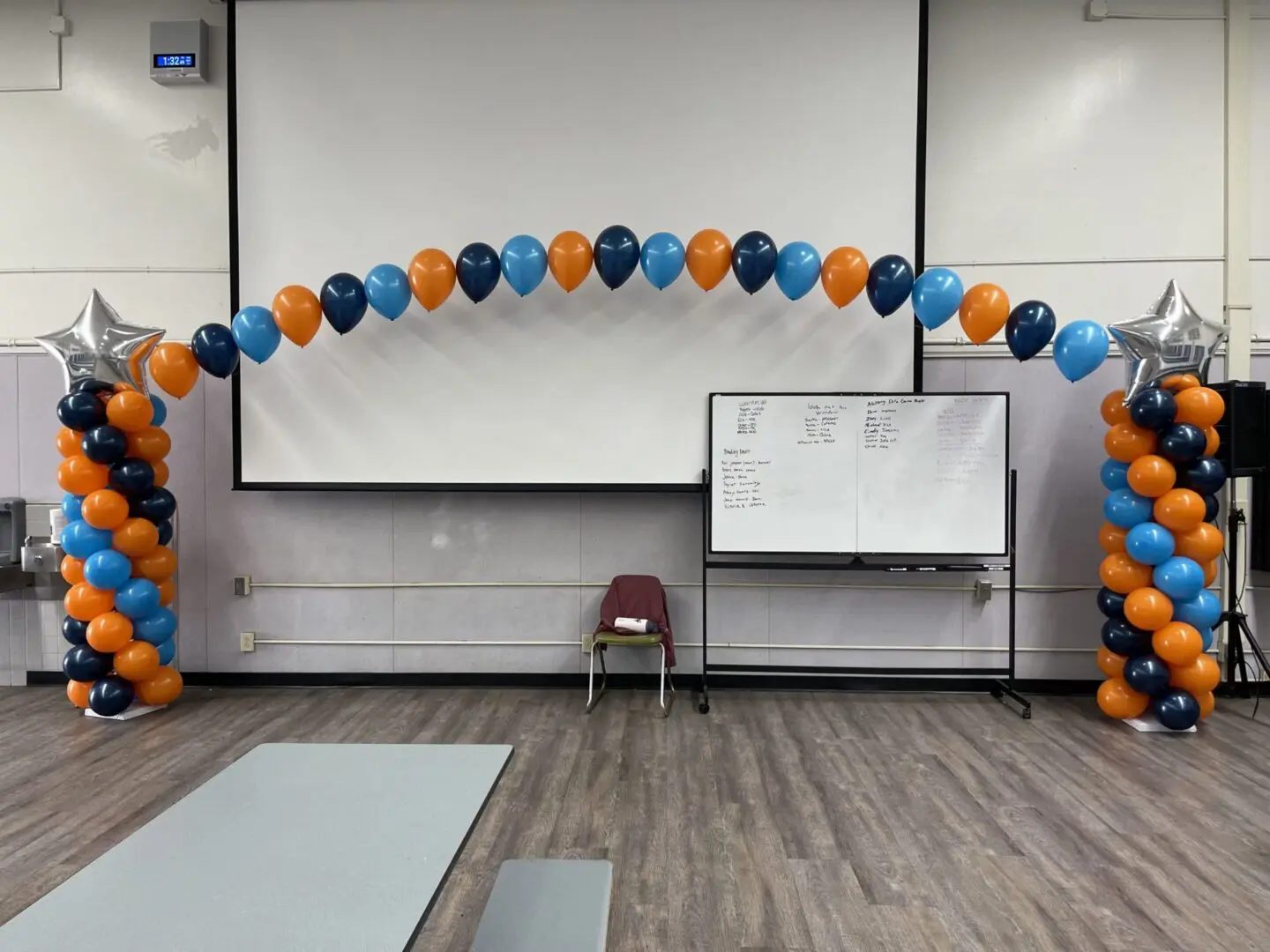 Blue and orange balloon arch with stars