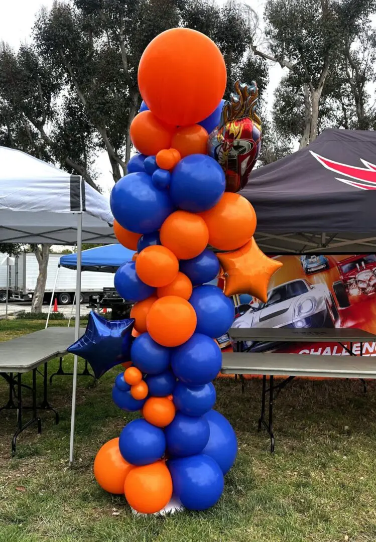 Orange and blue balloon column decoration