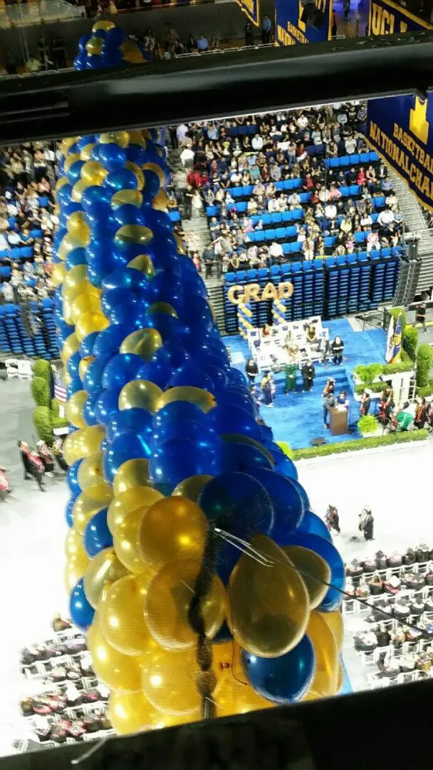 Blue and gold graduation balloon column