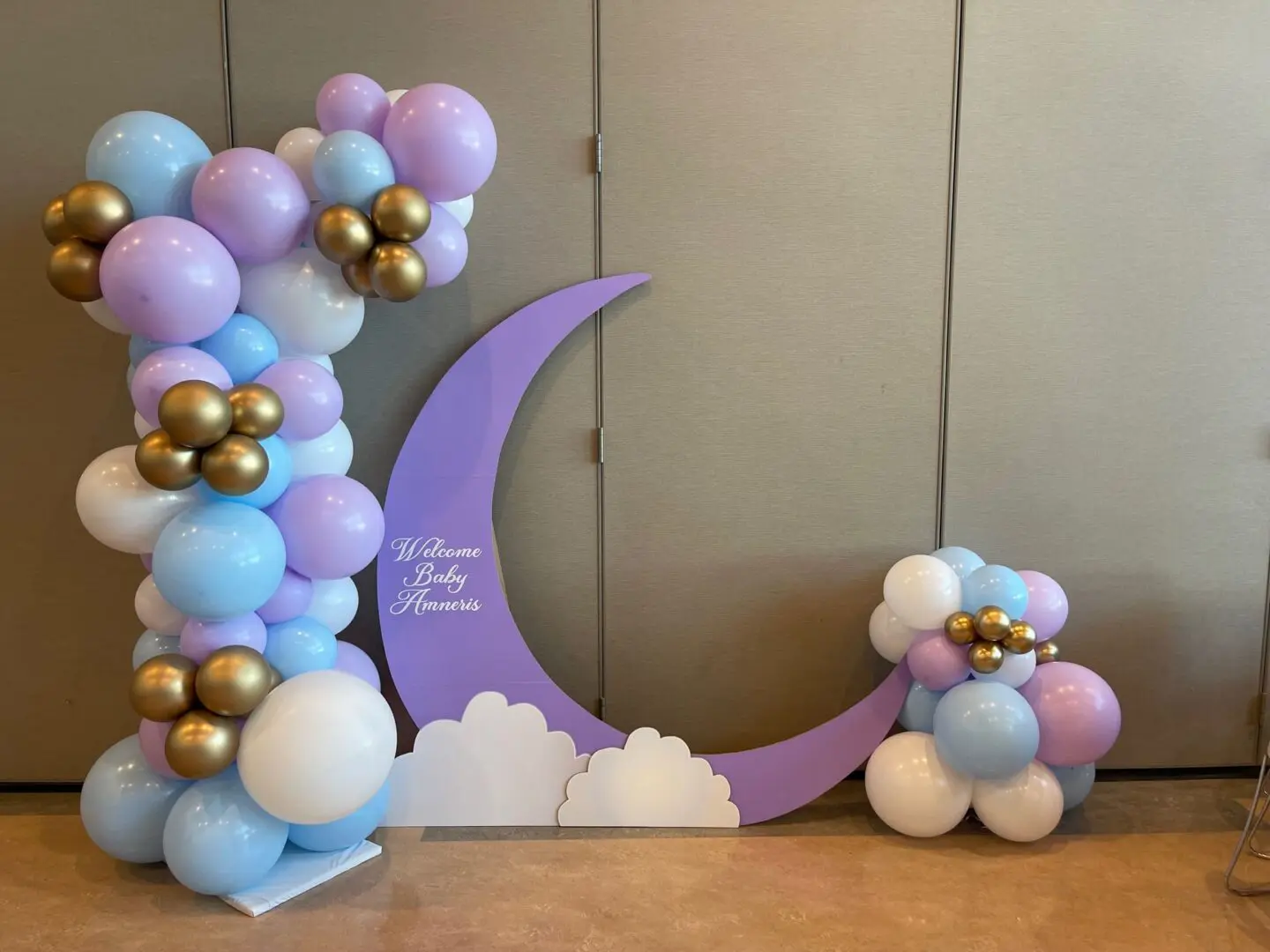 Pastel balloon display with purple crescent moon
