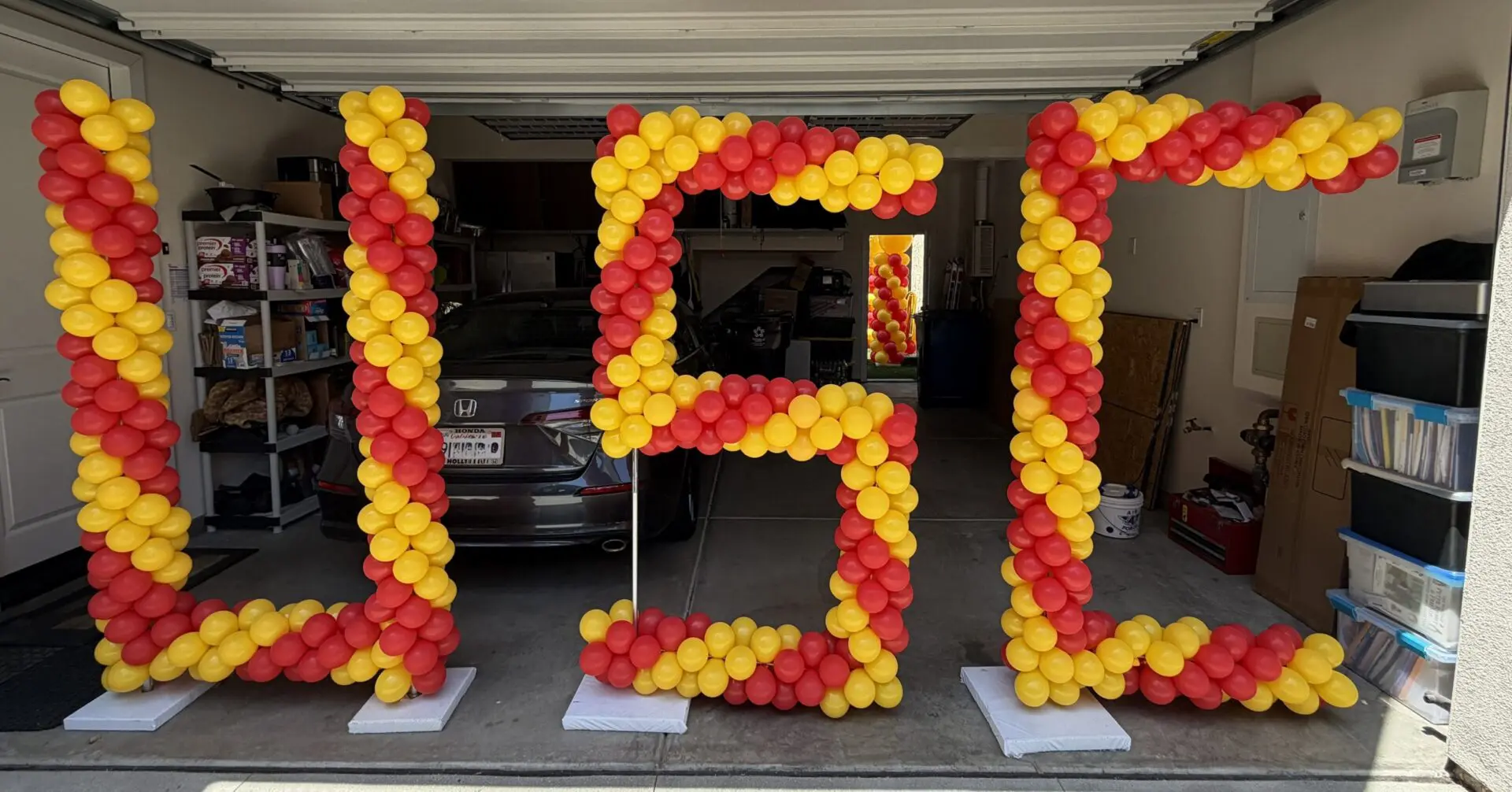 Red and yellow balloon letters spelling USE