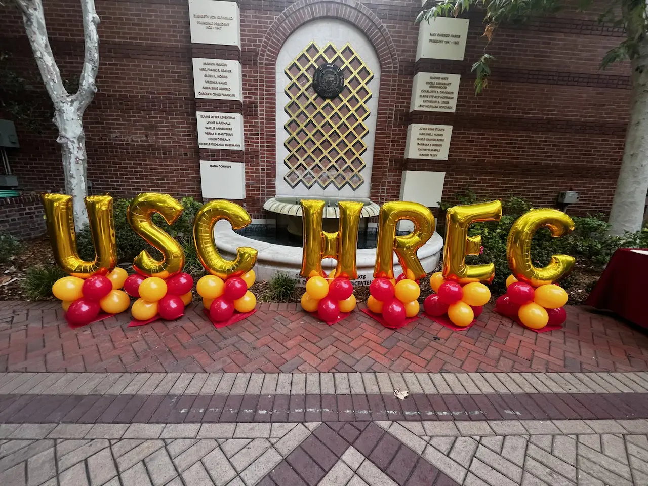 Gold 'USC THREC' balloons with red and yellow
