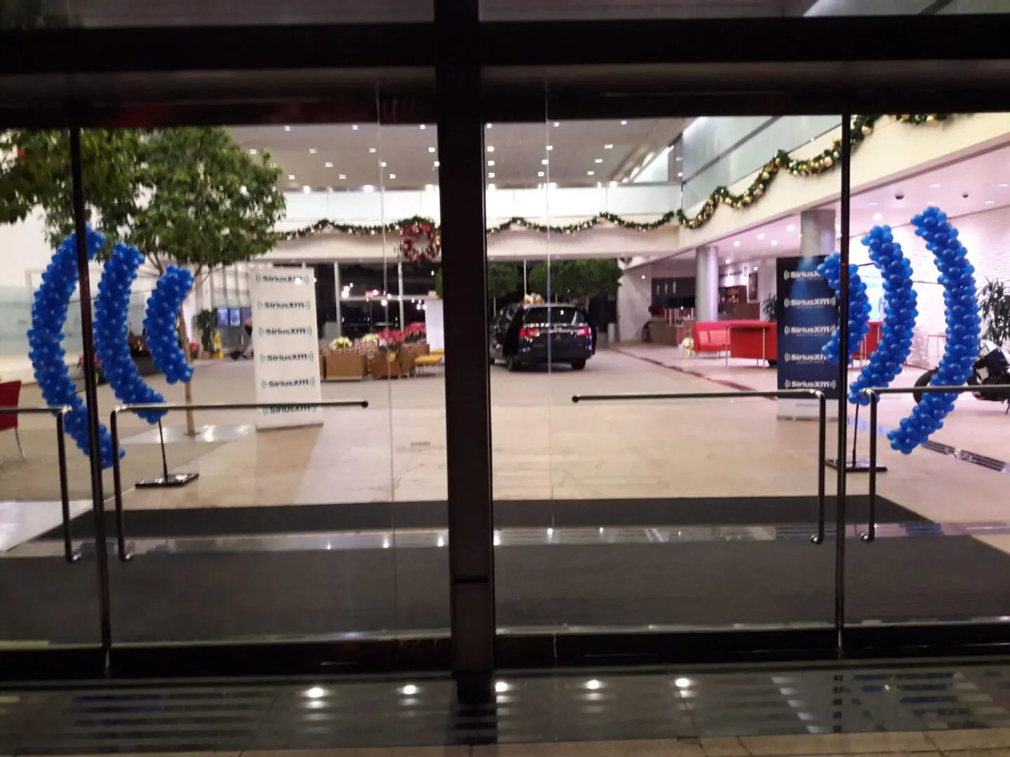 Hotel lobby entrance with blue balloon arches