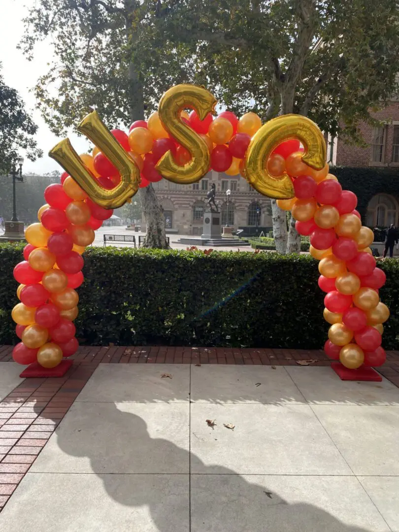 USC red and gold balloon arch