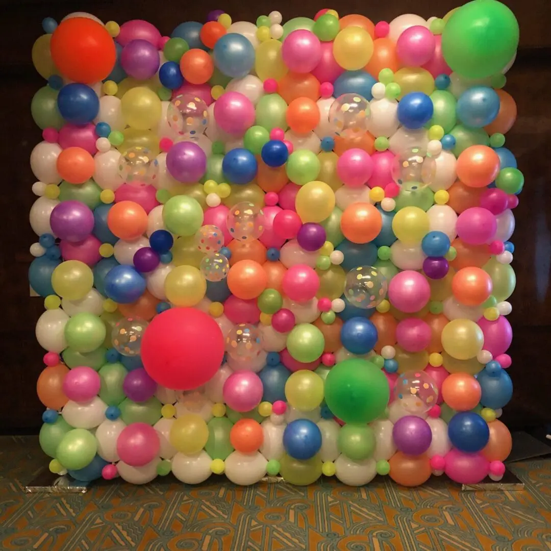 Vibrant multicolored balloon wall backdrop
